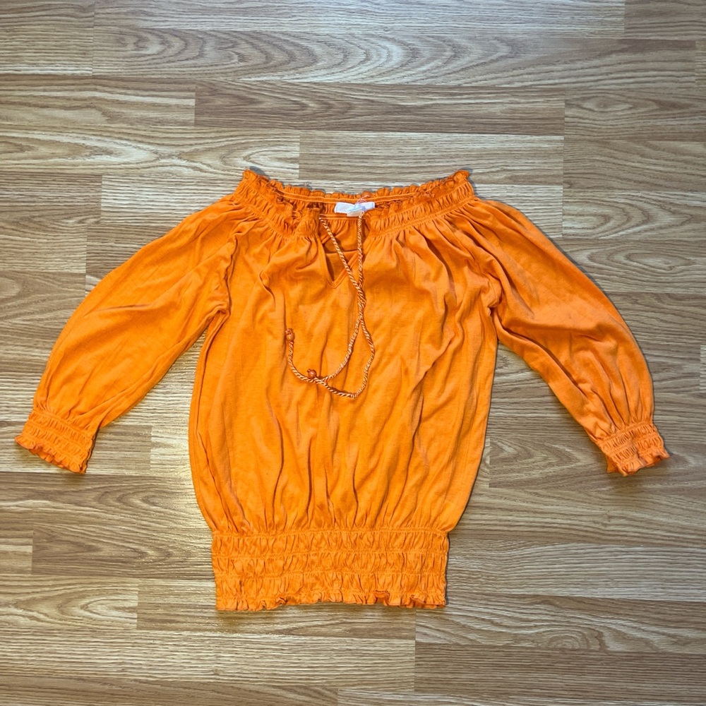 Orange off the shoulder blouse with a boho vibe